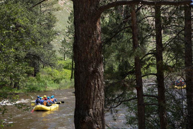 Raft floats on the Poudre River.