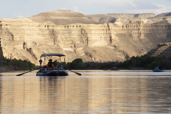 raft in front of canyon walls