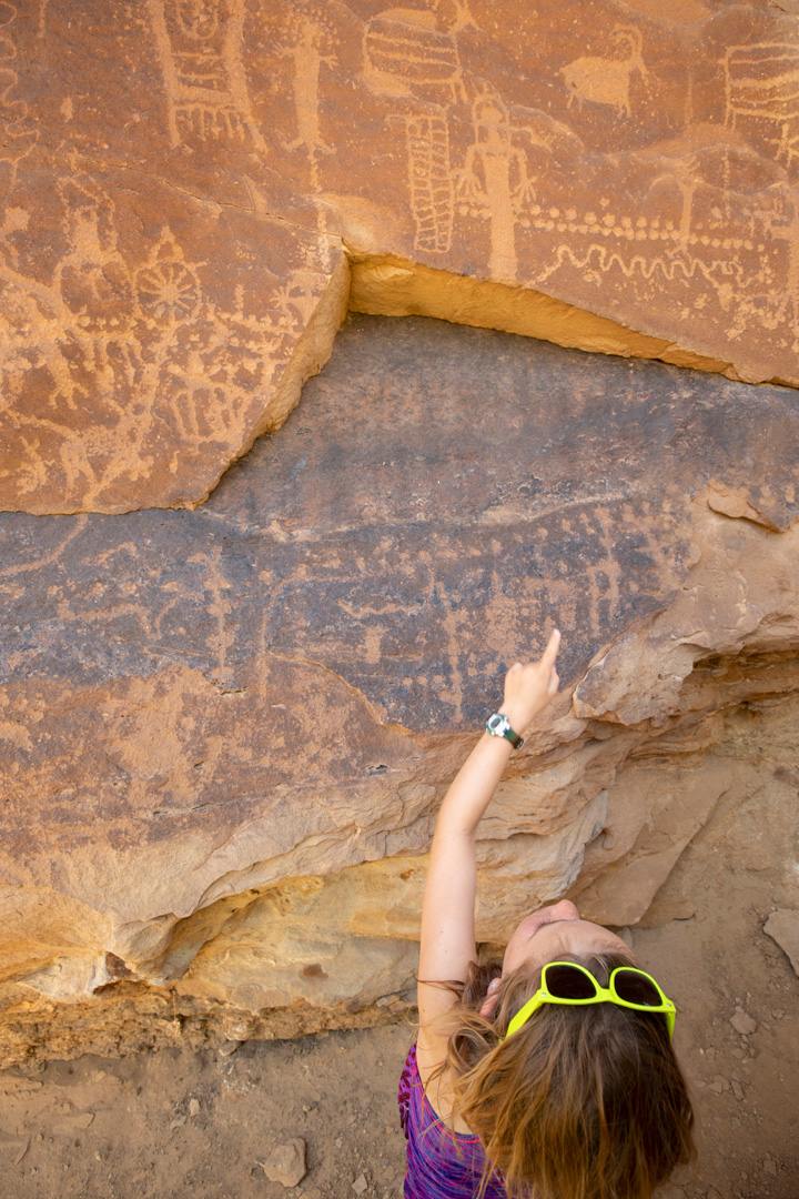 child points to petroglyphs