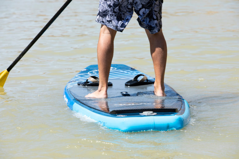 feet on a SUP