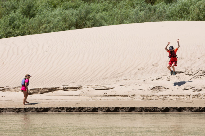 kids playing on river beach