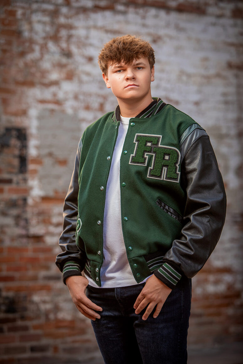 High school senior in letterman jacket