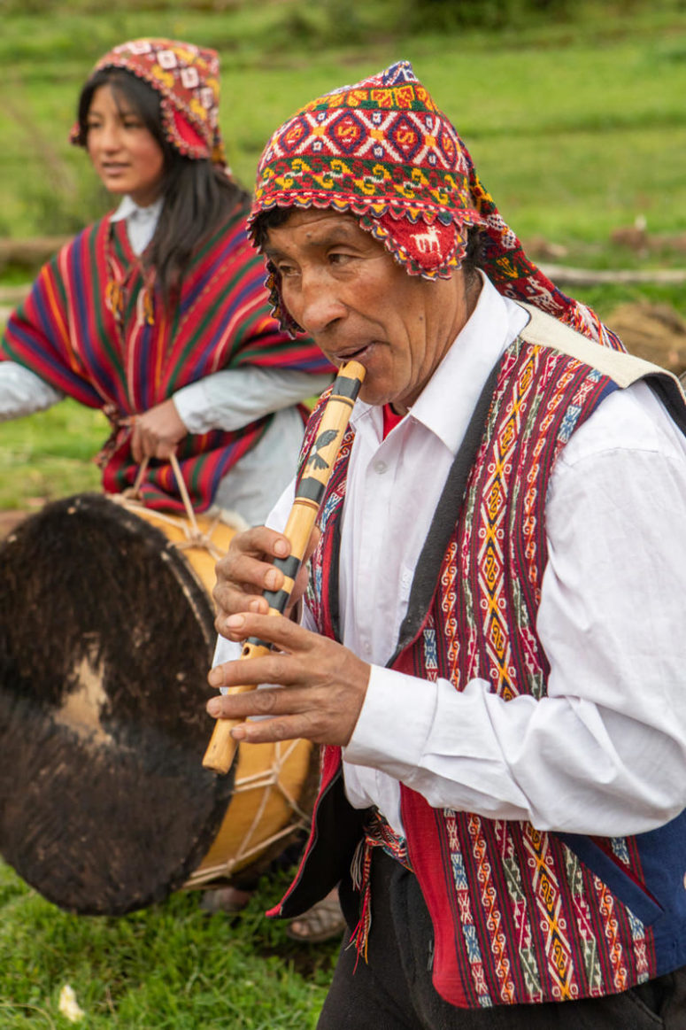 Peruvian man playing flute