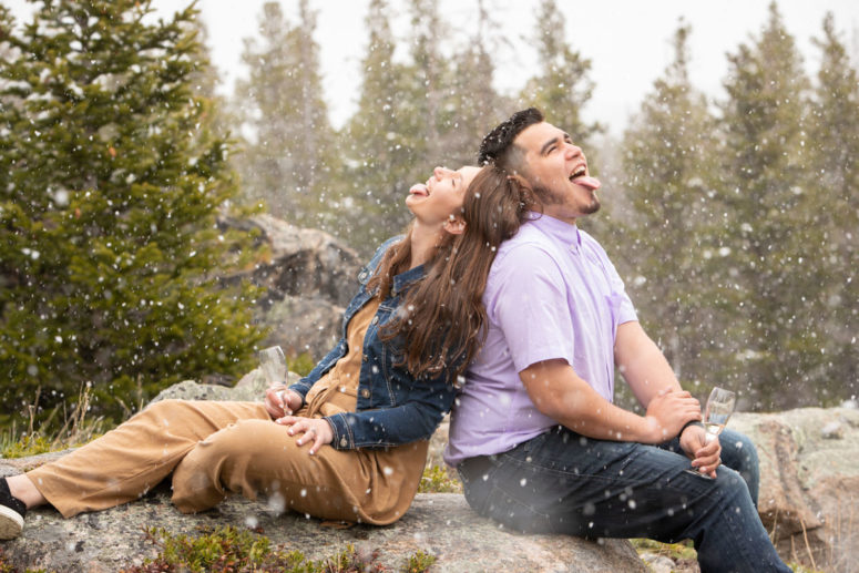 engaged couple in falling snow