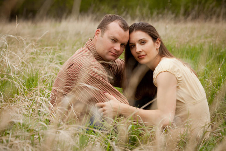 couple in field of wild grass