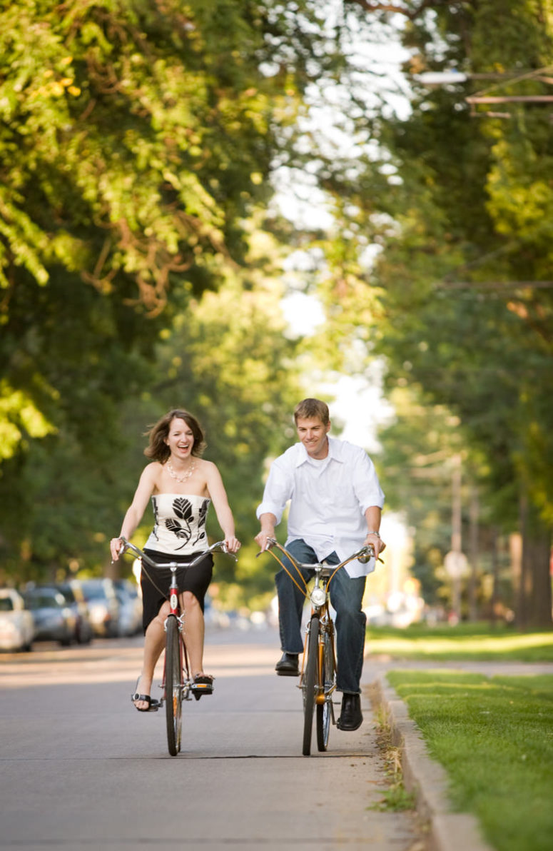 engagement photography couple riding bikes