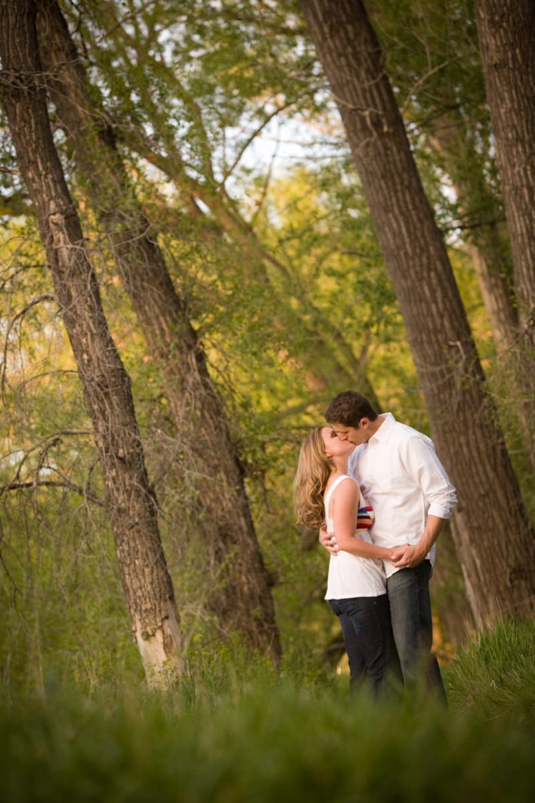 couple kissing in forest