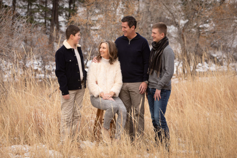 family portrait of four in grass