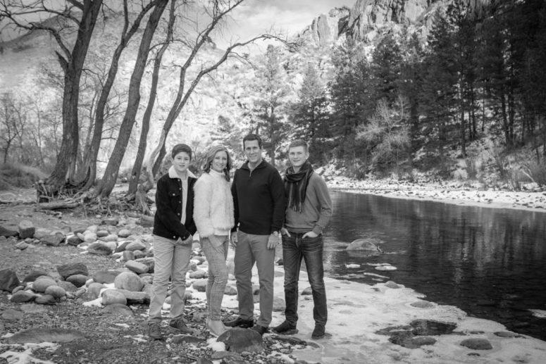 family along riverbank