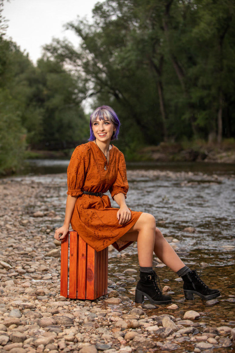 senior photo girl on river rocks