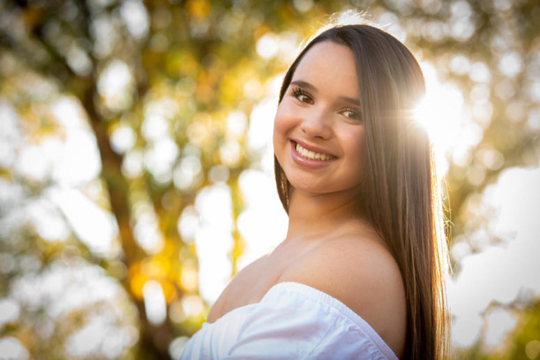 girl with sun in background