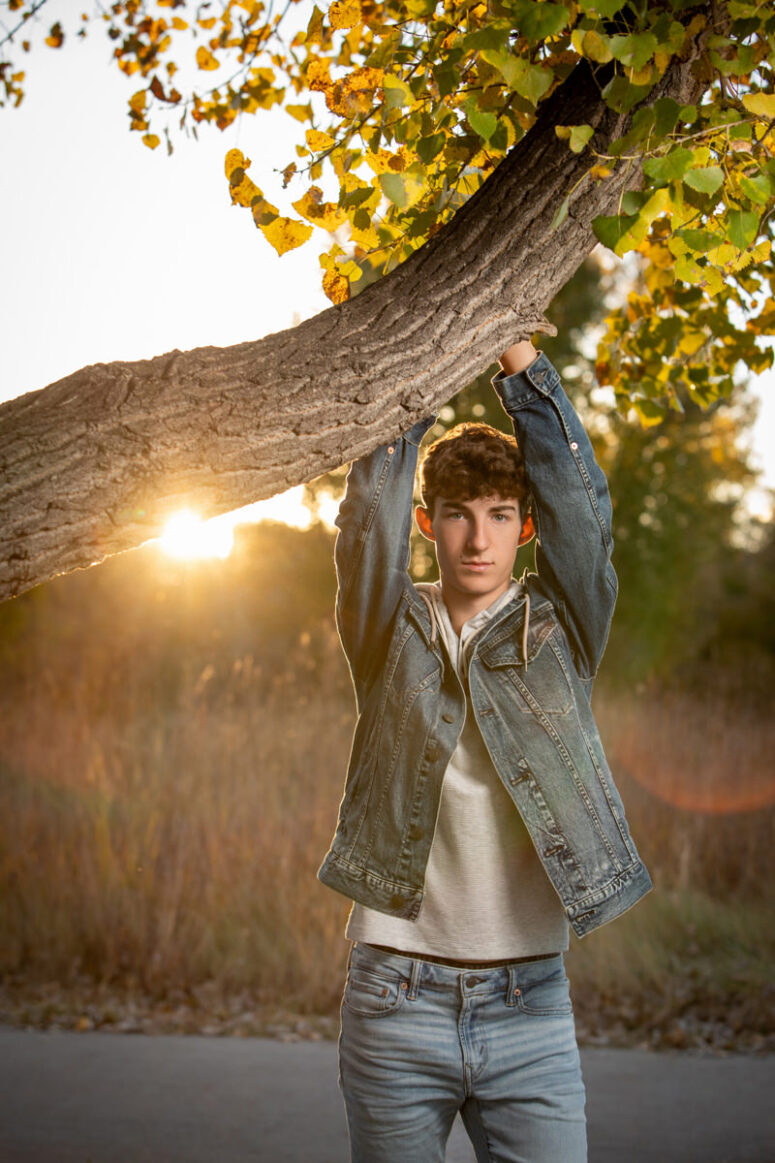 student in jean jacket at sunset in Fort Collins.
