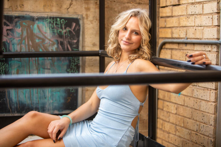 Girl in alleyway in blue dress